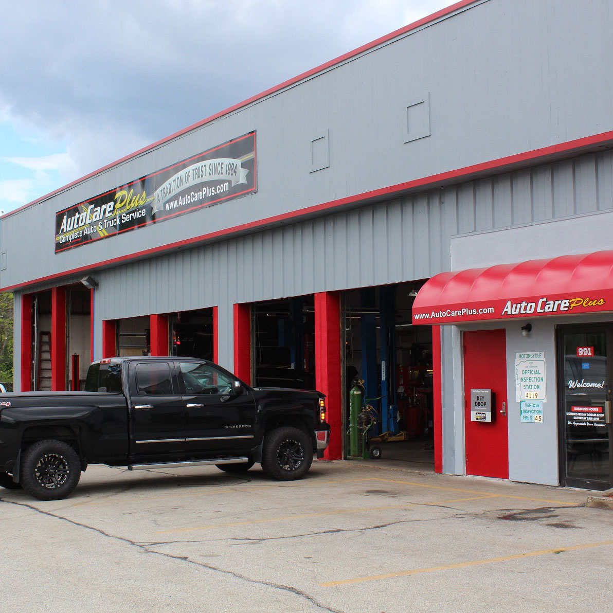 exterior of manchester garage with all doors open