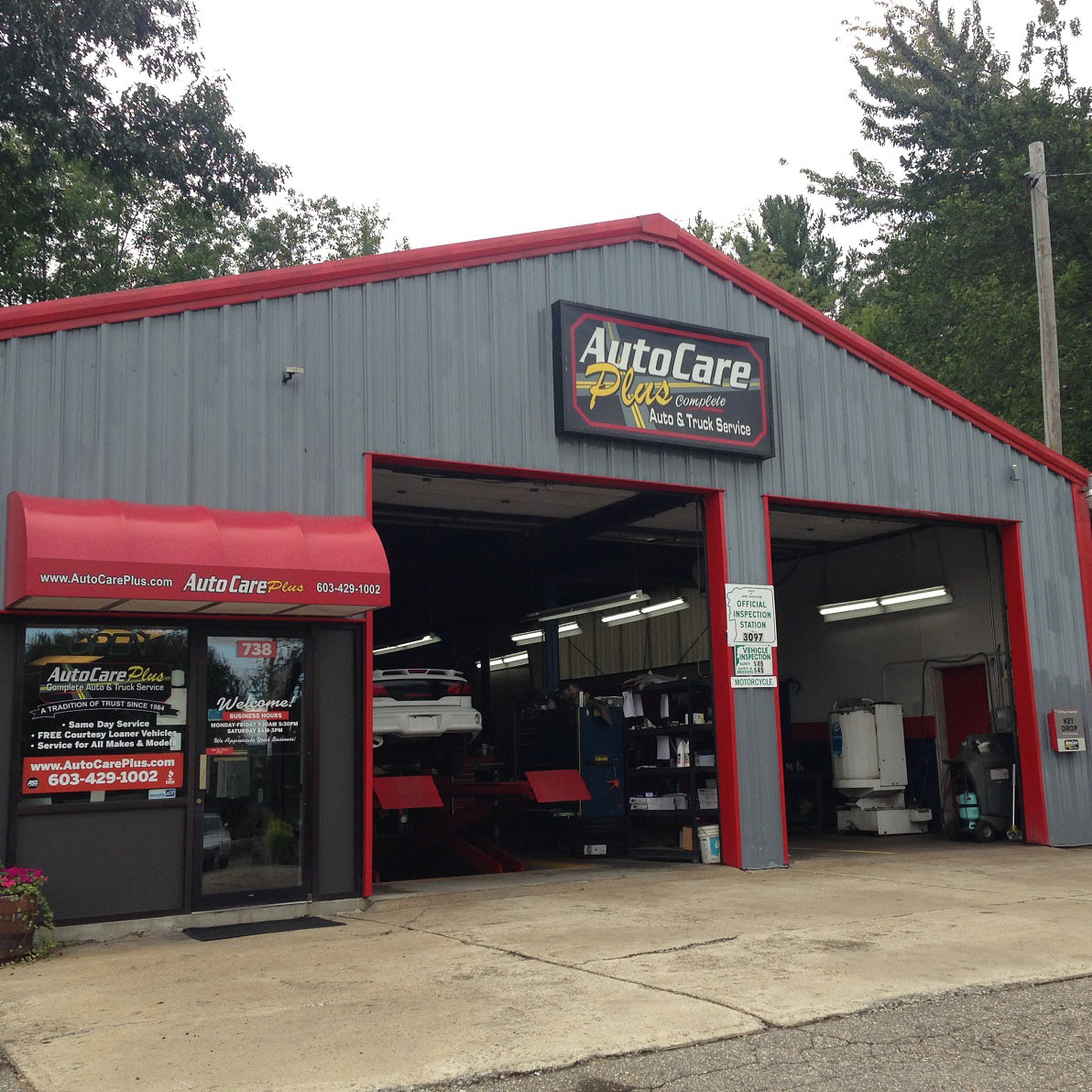 merrimack shop exterior with garage doors open