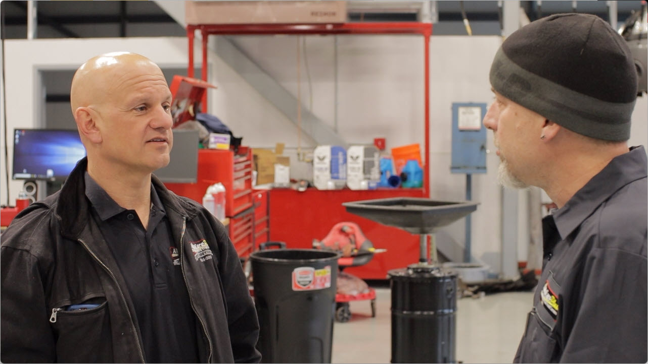 automotive-technician-careers-in-manchester-nh manager talking to service technician